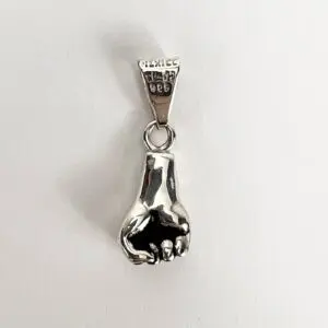 Silver hand-shaped pendant with engraved markings.