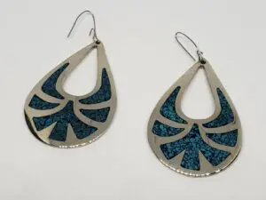 Silver teardrop earrings with blue inlay.