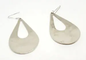 Silver teardrop-shaped earrings on white background.
