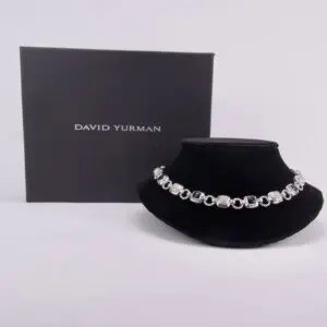 Silver necklace with David Yurman packaging box.