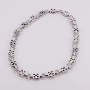 Silver bracelet with skull-shaped links.