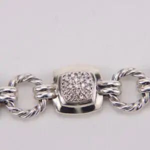 Silver bracelet with diamond accent detail.