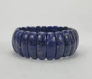 Blue stone bracelet with rounded segments.