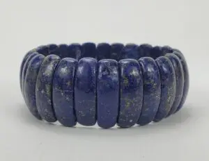 Blue stone beaded bracelet on display.