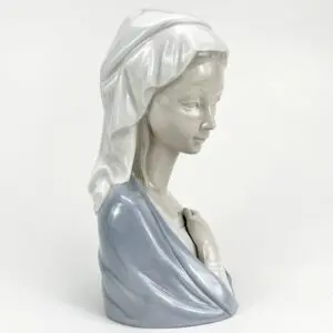 Porcelain bust of a woman with shawl.