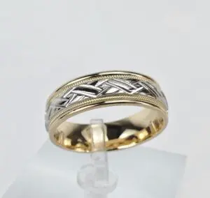 Gold and silver patterned wedding band.