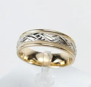 Two-tone braided design gold ring.