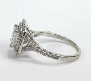 Silver diamond ring with intricate detailing.
