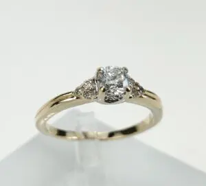 Gold ring with a diamond centerpiece.