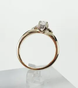 Gold ring with a diamond solitaire setting.