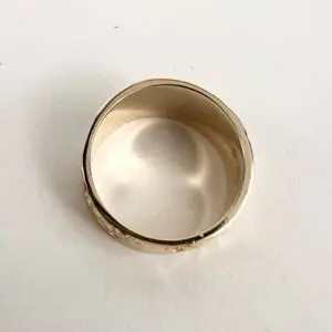 Gold ring on a white background.