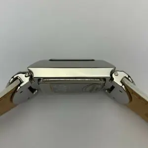 Smartwatch with leather strap, side view.