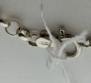 Silver chain with "925" marking and clasp.