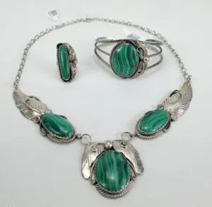 Green gemstone jewelry set with silver accents.