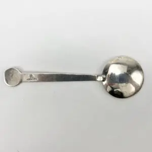 Silver spoon on a white background.