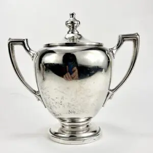 Silver trophy cup with two handles.