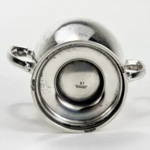 Bottom view of a silver metal cup.