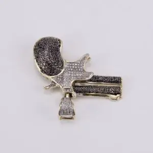 Diamond-studded film camera-shaped brooch.