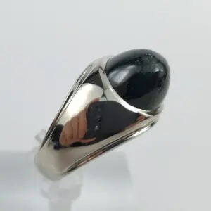 Silver ring with black gemstone.