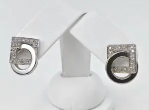 Silver earrings with square and circle design.