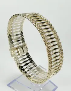 Gold bracelet with intricate chain design.