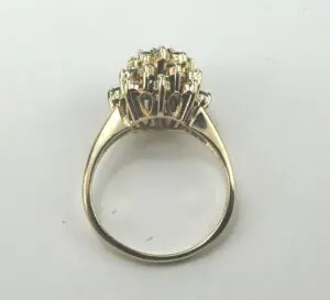 Gold ring with intricate gemstone setting.