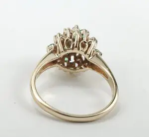 Gold ring with intricate gemstone setting.