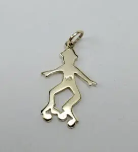Gold roller skater pendant on white background.