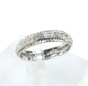 Silver ring with intricate diamond detailing.