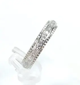 Silver ring with embedded clear stones.