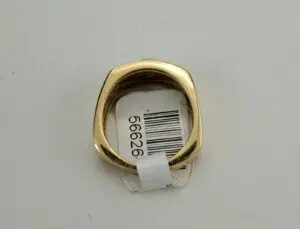 Gold ring with a barcode tag.