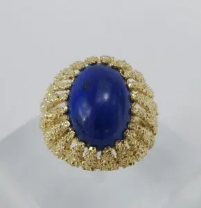 Gold ring with a blue stone.