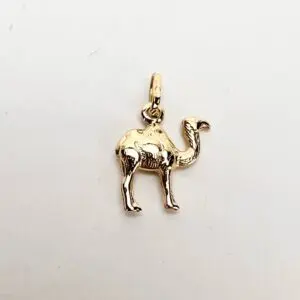 Gold camel-shaped pendant on white background.