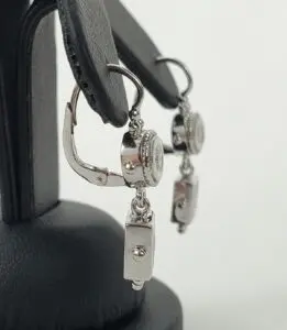 Silver earrings with rectangular dangle design.
