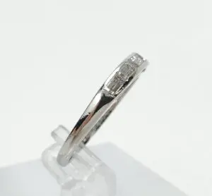 Silver ring with small rectangular stones.