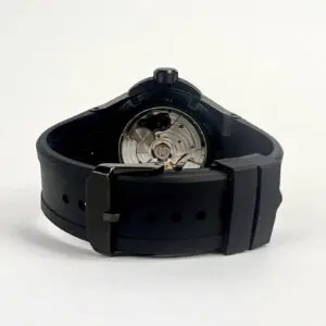 Black watch with visible mechanical movement.