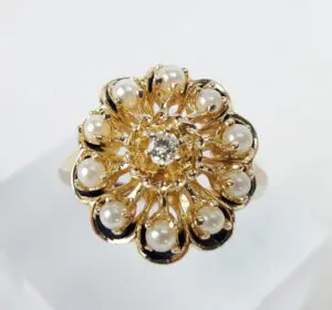 Gold floral ring with pearls and diamond.