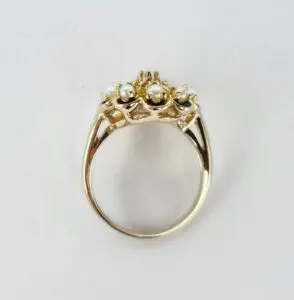 Gold ring with pearls and gemstones.