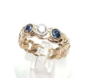 Gold ring with sapphires and diamond.