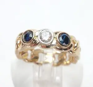 Gold ring with sapphire and diamond stones.