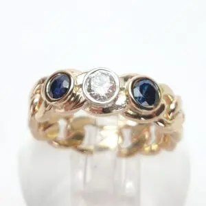 Gold ring with sapphire and diamond stones.