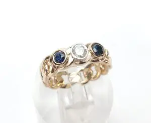Gold ring with sapphire and diamond stones.