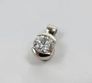 Diamond pendant with silver setting.