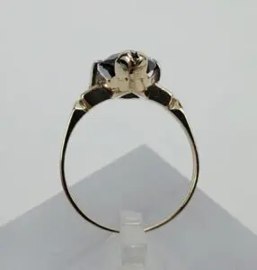 Gold ring with intricate animal design.