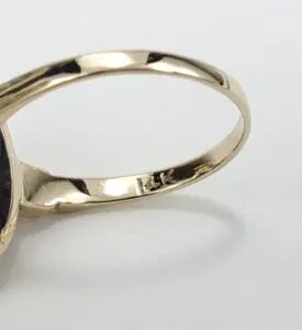 Gold ring with "14K" engraving on band.