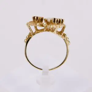 Gold ring with intricate crown-like setting.