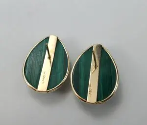 Green teardrop earrings with gold accents.