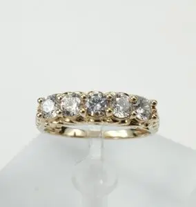 Gold ring with five sparkling diamonds.