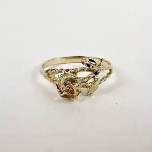 Gold ring with intricate floral design.