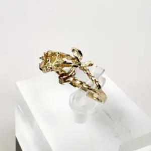 Gold rose ring on display stand.